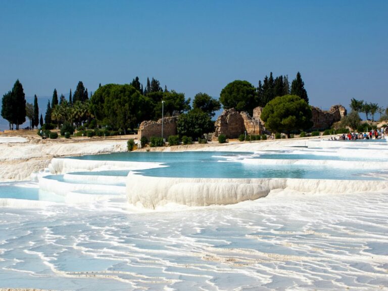 White travertine terraces of Pamukkale with thermal pools in Turkey