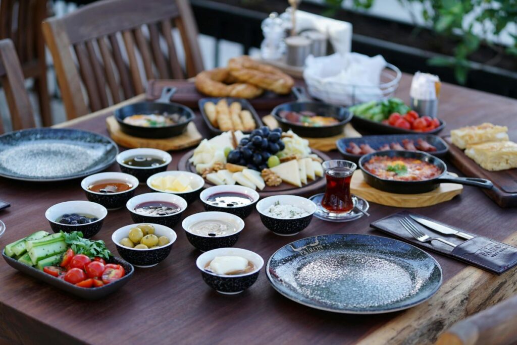 Traditional Turkish breakfast table with tea cheese olives and bread