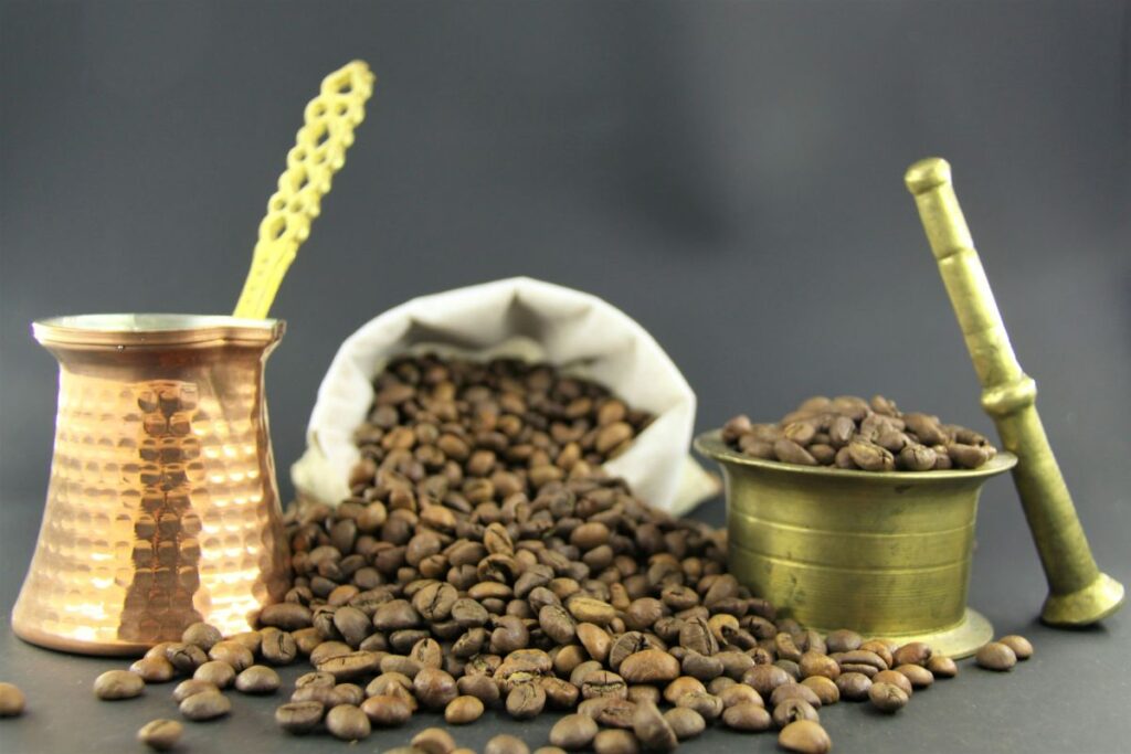 Coffee beans and traditional coffee preparation connected to the origins of coffee culture