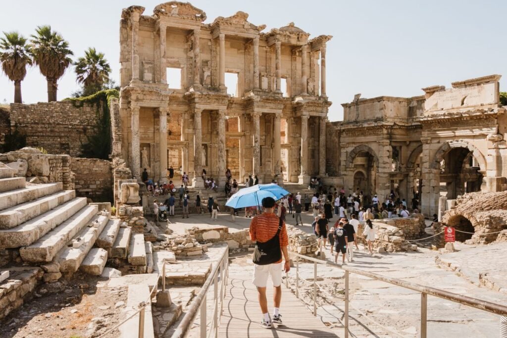 Travelers exploring the Library of Celsus in Ephesus